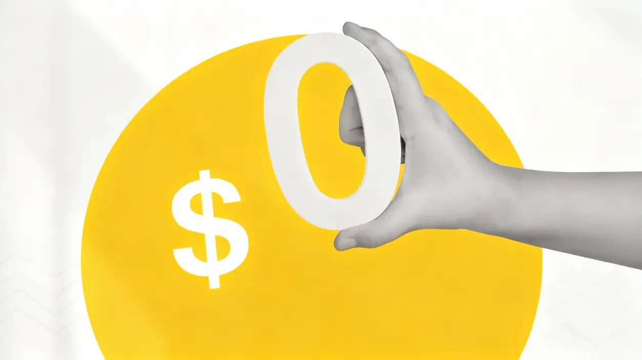 Una mano tiene una cifra zero davanti a un simbolo del dollaro su sfondo giallo