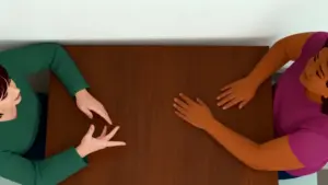 Due persone sedute a un tavolo discutono, viste dall'alto